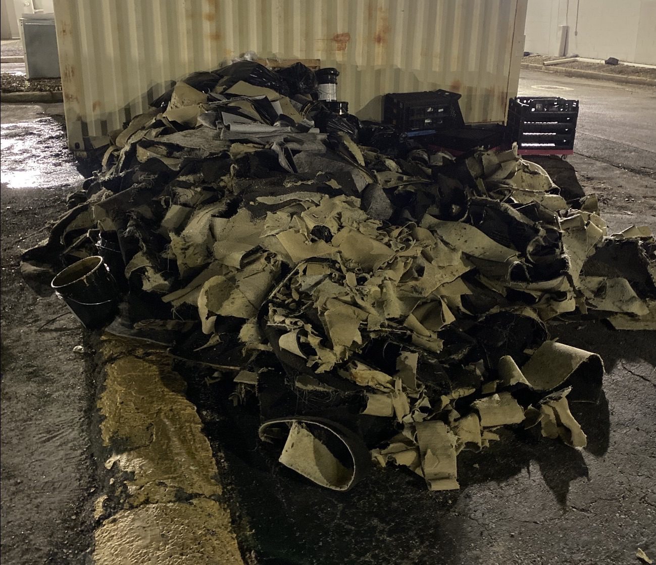 Pile of carpet and demolition debris before commercial cleanup by Aventis Junk Removal