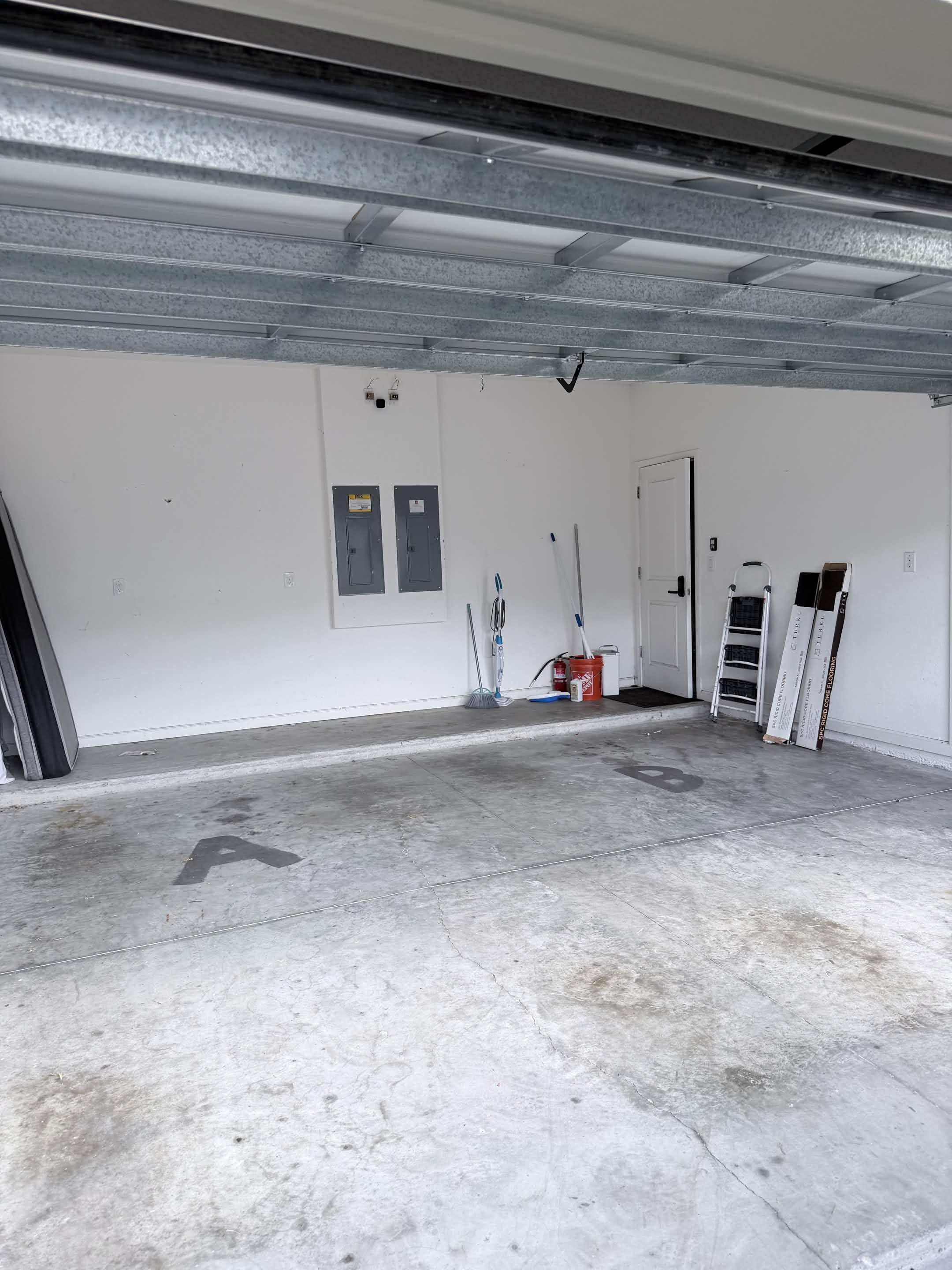 Empty, fully cleared garage after Aventis Junk Removal cleanout service