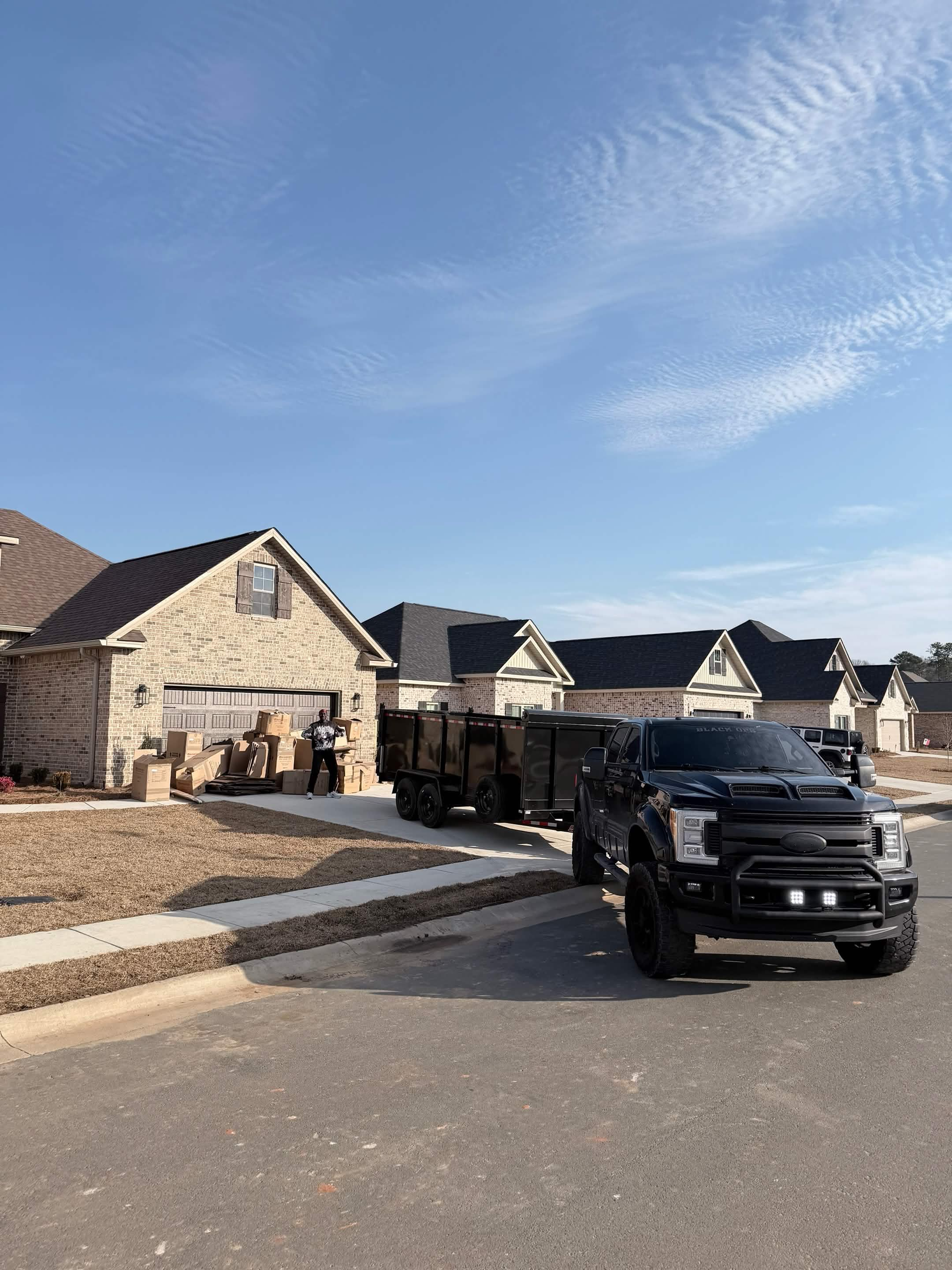 Aventis Junk Removal truck at residential pickup